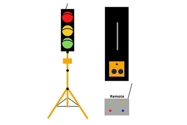 a traffic light and a tripod with a remote control.