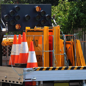 A truck carrying traffic cones.