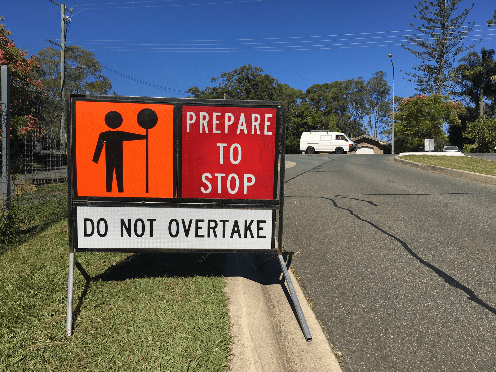 A Traffic sign that says prepare to stop and don't overtake.