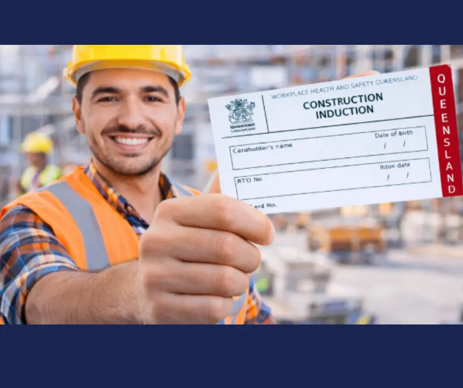 Construction worker holding a Queensland White Card construction induction card on a building site