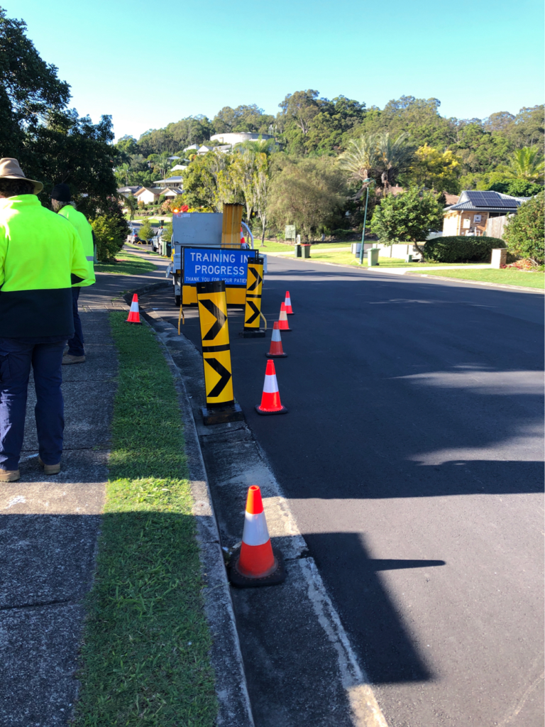 Traffic Management implementation (TMI) practical training setup in Bundaberg with traffic cones, signage and roadwork traffic control equipment.