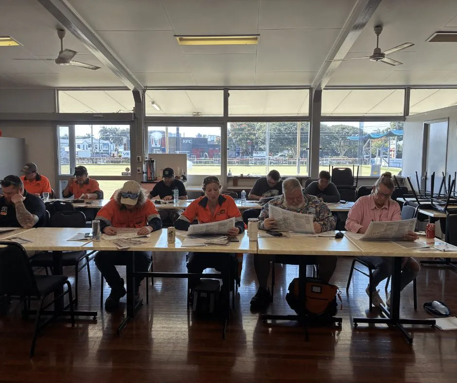 Traffic management training participants completing classroom theory assessment during a Traffic Management Implementer (TMI) course in Queensland.