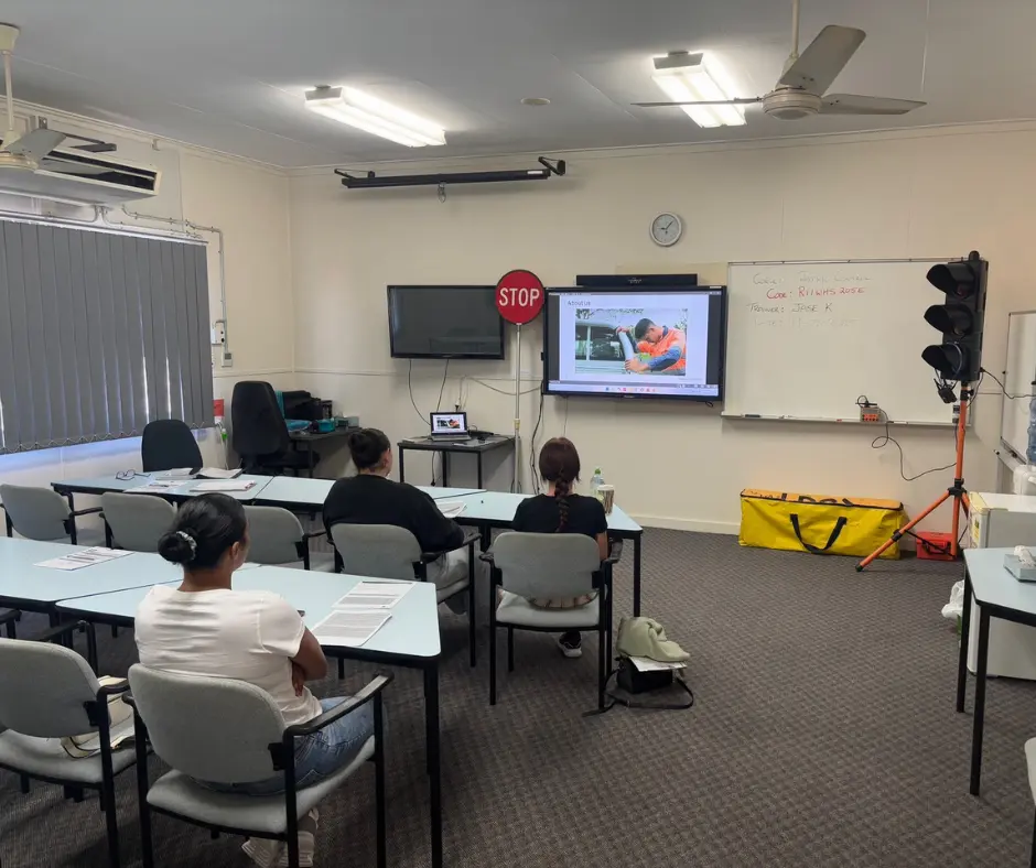 Students participate in a Traffic Management Implementer (TMI) theory training session in Rockhampton, learning traffic management procedures in a modern classroom with experienced trainers at Upskills QLD.