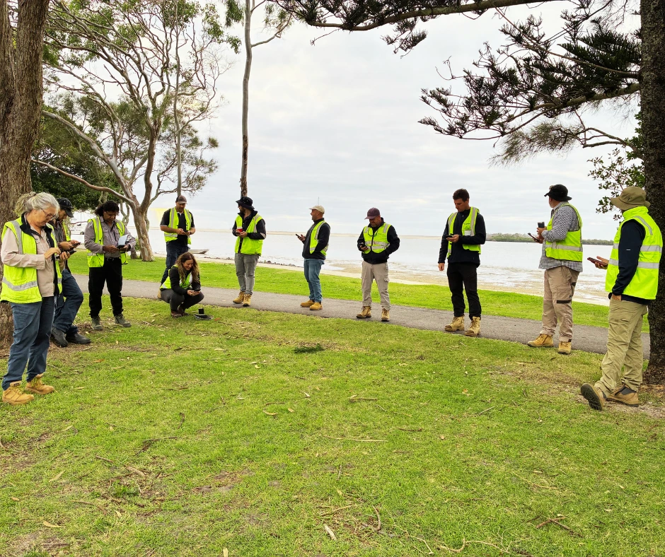 Upskills QLD participants completing practical TC & TMI in Sunshine Coast training, wearing high-visibility safety gear during an outdoor traffic management exercise.